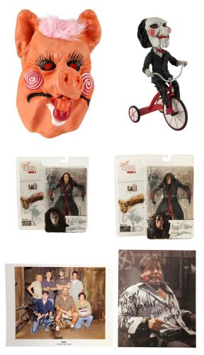 1079. David A. Armstrong Collection: Year of the Pig Mask with Creator- and Cast-Autographed Billy Bobblehead, Jigsaw Killer Action Figures, and Stills ### SAW FRANCHISE (2004 - PRESENT)