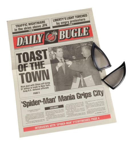 1113. Peter Parker's (Tobey Maguire) Pair of Spider-Man Suit Lenses with Production-Made "Toast of the Town" Daily Bugle Newspaper ### SPIDER-MAN (2002)