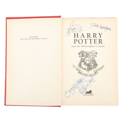 172. Daniel Radcliffe, Emma Watson and Rupert Grint-Autographed Harry Potter and the Philosopher's Stone Deluxe Hardback Book ### HARRY POTTER AND THE PHILOSOPHER'S STONE (2001)