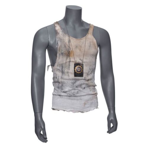 70. John McClane's (Bruce Willis) Distressed Tank-Top and Police Badge ### DIE HARD WITH A VENGEANCE (1995)