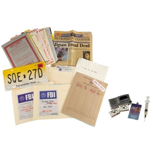 1103. Planet Hollywood Collection: Agent Peter Strahm's (Scott Patterson) ID Card with Collection of FBI Files, Recorder, and License Plate ### SAW V (2008)