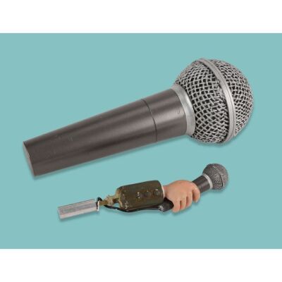 Lot # 80. Interviewer&rsquo;s Hand and Microphone with Large Microphone Prop ### CREATURE COMFORTS AMERICA (T.V. SERIES, 2007)