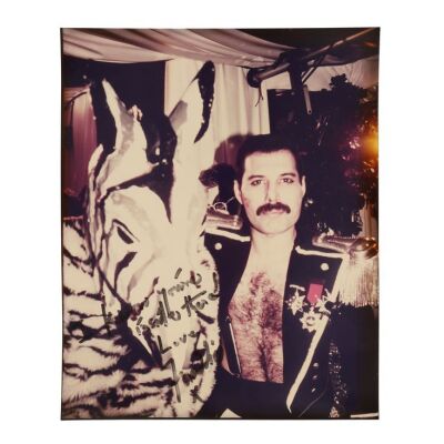 Lot # 296. The Reinhold Mack Collection: Freddie Mercury-Autographed Black and White Party Photograph ### QUEEN
