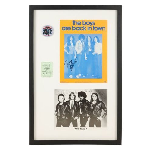 Lot # 373. Framed Phil Lynott, Brian Downey, Scott Gorham, Snowy White-Autographed Photo, Brian Robertson-Autographed Poster, and Gary Moore-Autographed Ticket ### THIN LIZZY