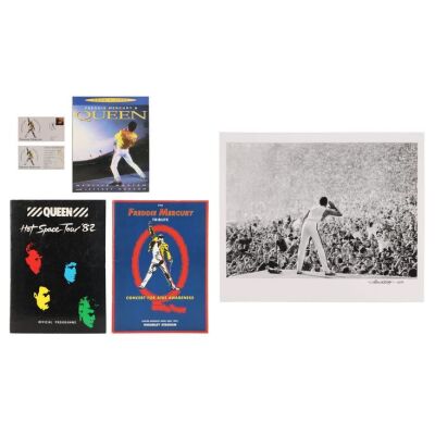 Lot # 317. The Denis O'Regan Collection: Freddie Mercury First Day First Class Cover Stamp, Limited Edition Maine Road Stadium Fine Art Print, Freddie Mercury Tribute Concert Programme, "Freddie Mercury & Queen" Book by Neville Marten and Jeffrey Hudson 