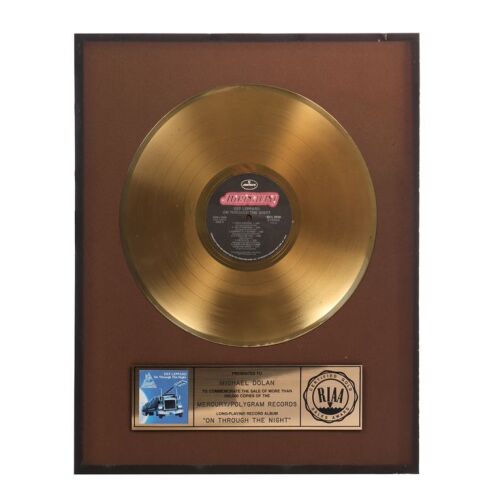Lot # 478. Unframed On Through the Night Gold Disc Award Presented to Michael Dolan ### DEF LEPPARD