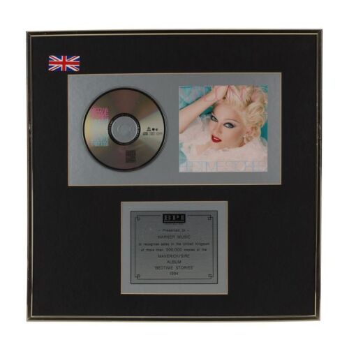 Lot # 563. Bedtime Stories Platinum CD Award Presented to Warner Music ### MADONNA