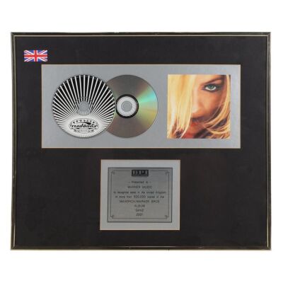 Lot # 564. GHV2 Double-Platinum Disc Award Presented to Warner Music ### MADONNA
