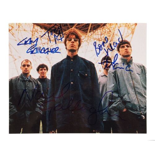 Lot # 615. Liam Gallagher, Noel Gallagher, Paul "Bonehead" Arthurs, Paul "Guigsy" McGuigan, and Tony McCarroll-Autographed Photograph ### OASIS