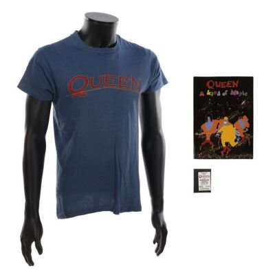 Lot # 729. Magic Tour T-Shirt, Programme and Knebworth Concert Ticket ### QUEEN