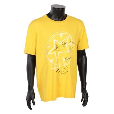 Lot # 735. Thom Yorke, Jonny Greenwood, Colin Greenwood, Philip Selway, and Ed O&rsquo;Brien-Autographed "Against Demons" Yellow T-Shirt ### RADIOHEAD