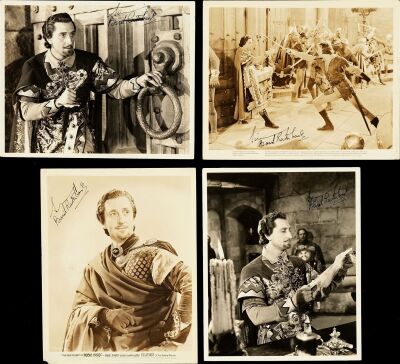 297. Vintage Original B&W Single-Weight Gelatin Silver Glossy Photographs (4) (8" x 10") Signed by Basil Rathbone (4) (JSA COA); Very Fine ### THE ADVENTURES OF ROBIN HOOD (1938)