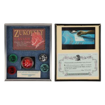 Lot # 297. Elektra King (Sophie Marceau) Cheque, Caviar Jar, and Casino L'Or Noir Casino Chips ### JAMES BOND: THE WORLD IS NOT ENOUGH (1999)